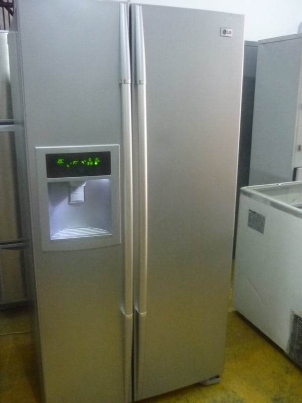 Used Refrigerator-Used LG Side By Side Silver Refrigerator With Dispenser